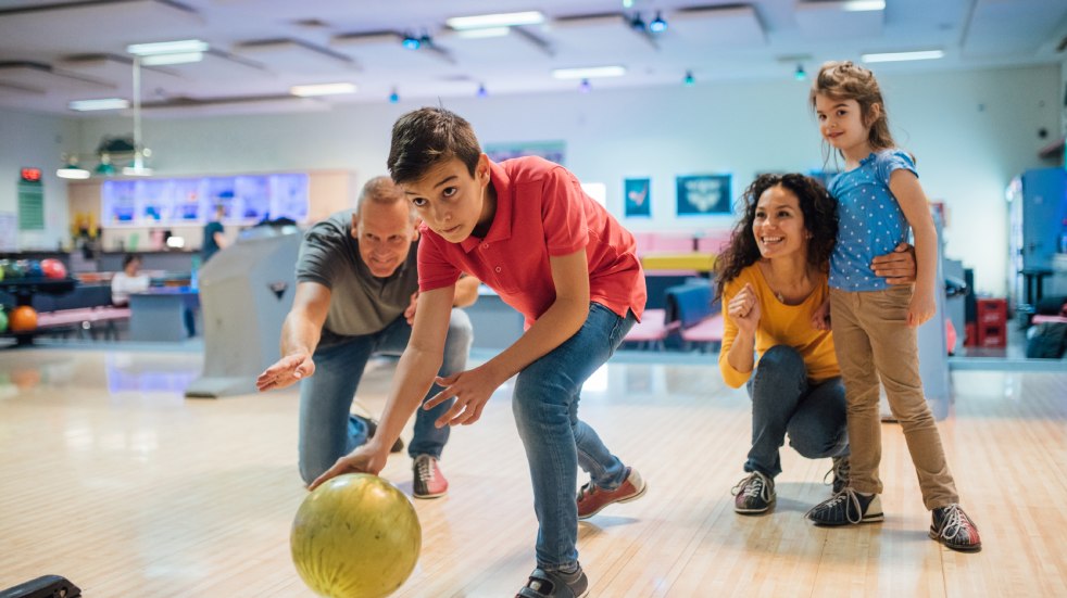 Family of four bowling